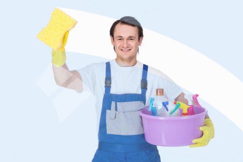 Staff member managing cleaning work with caution and supervision